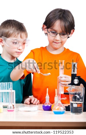 Two little boys doing biochemistry research at the lab. Isolated on white