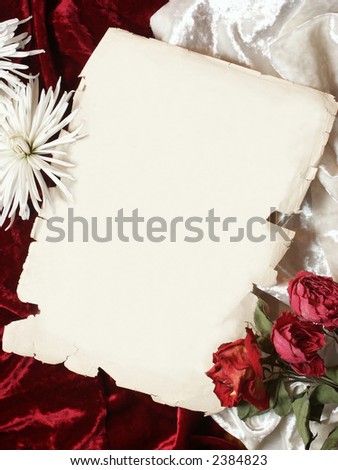piece of old paper, red and white velvet wrinkles background, desiccated red roses and white chrysanthemum