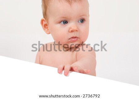 baby holding paper