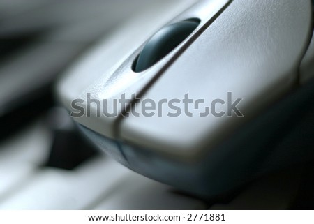 Closeup of wireless computer mouse with two buttons and scrolling wheel. Soft-focused