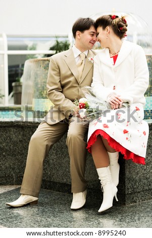 Happy couple at the fountain (vintage wedding)