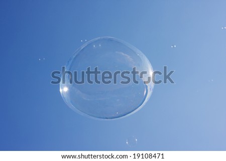 Soap bubble on the blue sky background