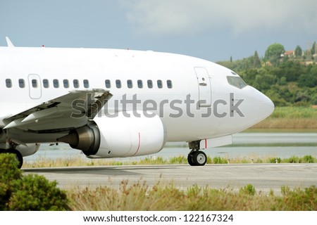 Close up image of passenger airplane on the runway, moments before take-off