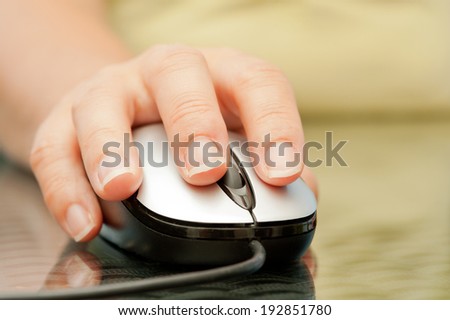 Closeup of woman hand holding mouse