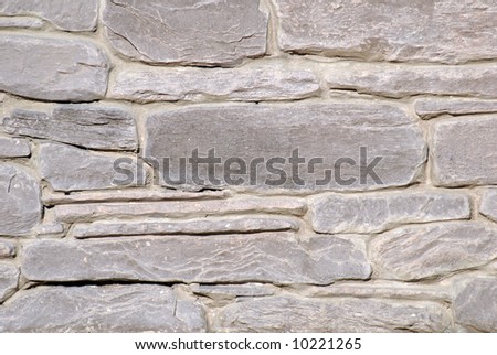 Wall made of bricks, close-up of stone bricks pattern