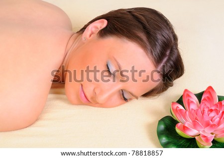 Young beautiful woman getting relaxing  in beauty massage salon
