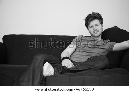 Young man poses, he has ginger hair