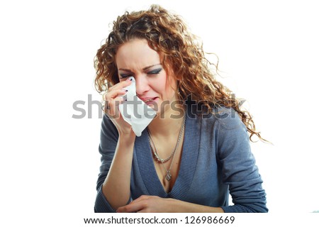 A sad beautiful woman crying , isolated on white background
