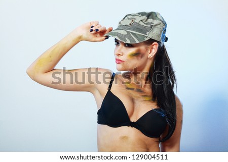 camo girl female fighter looking  aggressive over dark background