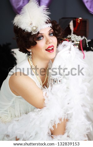 Beautiful young woman portrait in retro flapper style headband Vogue style vintage