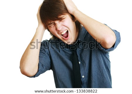 Man holding his hands up to his ears trying to mute all the voices he hears