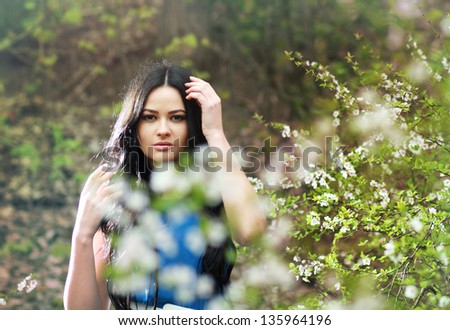 photo of romantic woman in fairy forest. Beauty spring time