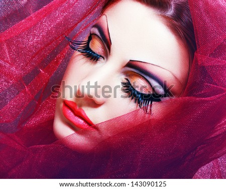Gorgeous Young model beautiful women with perfect art make up and long false eyelashes made from feathers