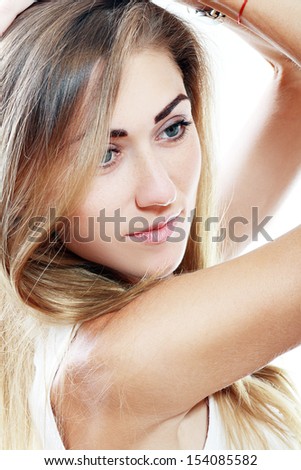 Beautiful adult blond skinny woman posing to camera close up