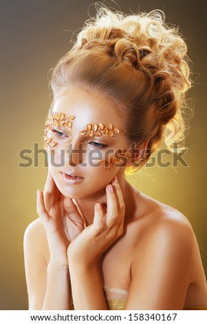 Beautiful Teen Model Fashion Glamour Makeup and Hairstyle. Glamor Golden Make-up.Holiday Gold Makeup