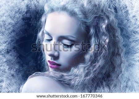 ice-queen. Young winter woman in creative image with silver blue artistic make-up and perfect hairstyle.