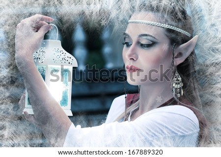 a fairy elf princess with snow ice on winter with lantern in her hand