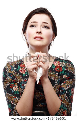 A sad beautiful woman crying studio shot on plain background