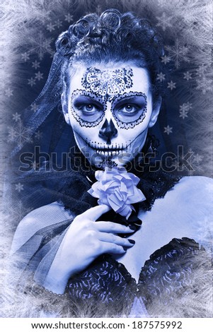 winter woman make up sugar skull beautiful model with ice. Santa Muerte concept.