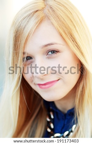 Closeup portrait of a happy blonde woman. Copyspace