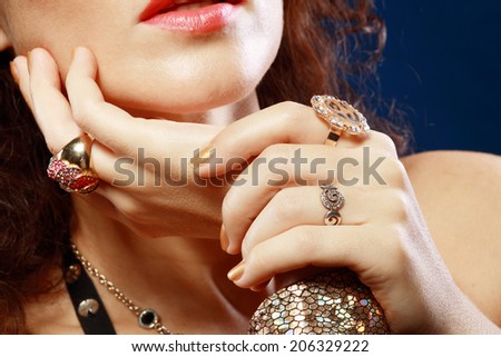 Woman with luxury jewelry hands close up