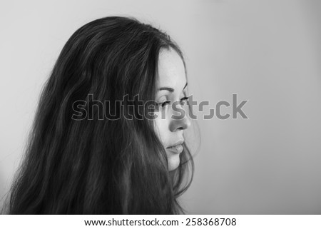 Portrait of sad and depressed woman deep in thought. Child abuse.