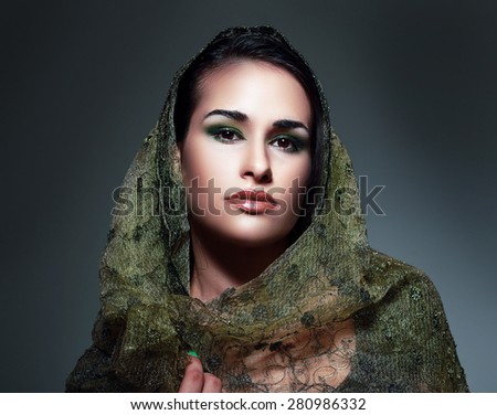 Indian beauty face close up perfect make up headscarf. Series. young beautiful brunette in traditional national dress