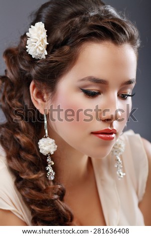 Portrait of Beautiful Woman Hair Wedding Model Over Pink Grey Background. Advertising and Commercial Design. Shopping. Jewelry - Bridal Earrings