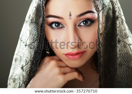 Indian beauty face close up perfect make up. Series. young beautiful brunette in traditional national dress