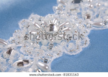 stock photo wedding lace with crystals over blue background