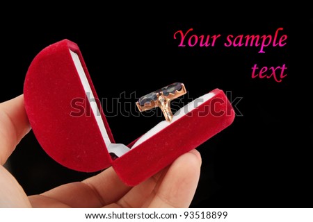 postcard template ring with big stone in a red box over black background