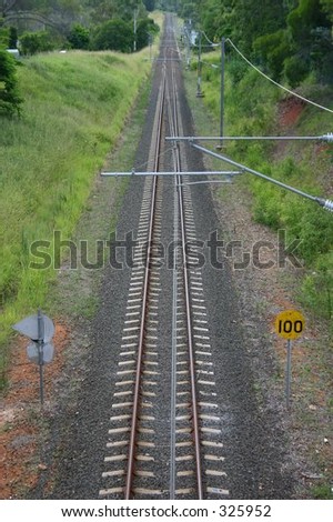 Railway train tracks doing into distance
