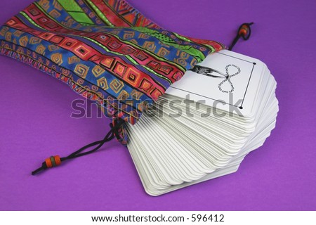 The back of a deck of tarot cards in colorful bag