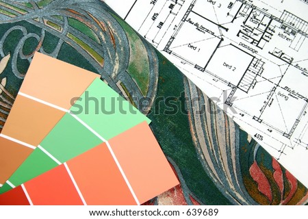 Curtain fabric and paint swatches on top of house floor plan for interior design selection