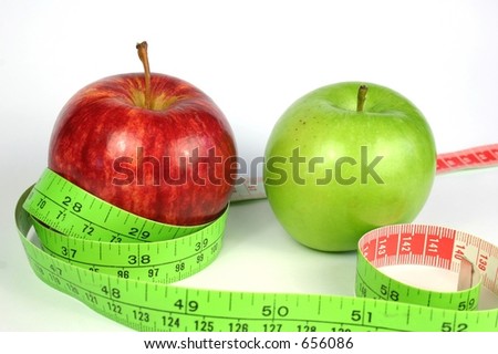 Two apples for diet with tape measure