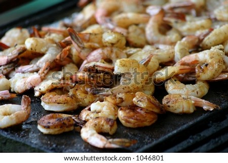 prawns / shrimp cooking on barbecue / bbq