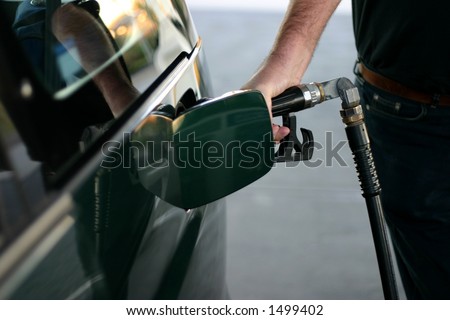 man refueling car at petrol station
