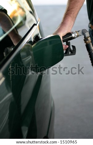 Man refueling car at petrol station
