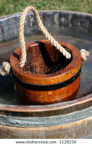 wooden water pail in barrel