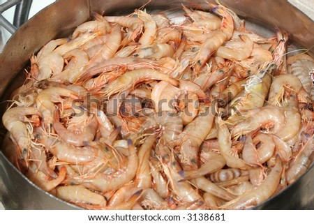 Close up of fresh prawns being cooked in steamer