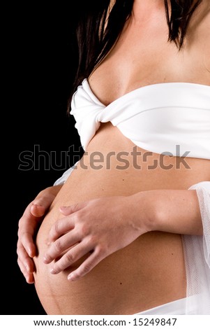 mother-to-be hands touching pregnant tummy
