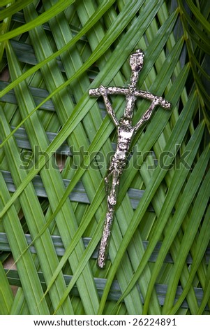 closeup of crucifix on palm leaves - palm sunday