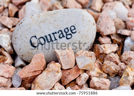 close up of \'courage\' stone on textured stone background
