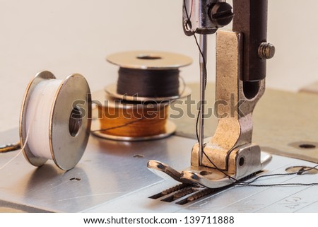 Sewing machine and thread rolling.
