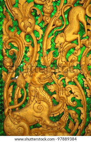 Animal carvings on the doors of the temple in the novel in a Thai temple.