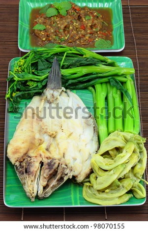 Thai cuisine name Steamed fish with boiled vegetables and sauce.