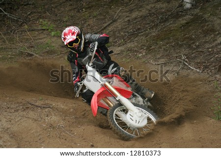 Lay it Over, A motocross rider laying his machine into a turn