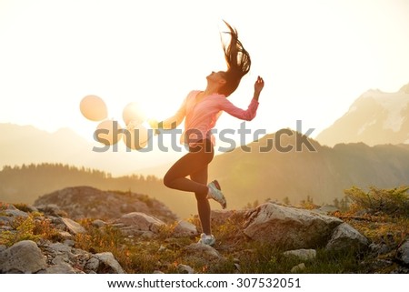 Girl dancing on Artist Point at sunrise, Mt. Baker, Washington