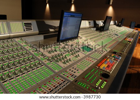 audio mixing console in studio