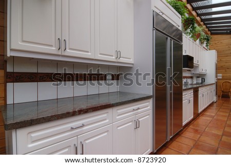 solarium kitchen with white wall unit